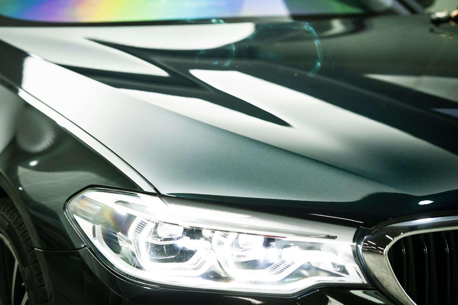 Deep, unbroken gloss across a protected bonnet and headlight