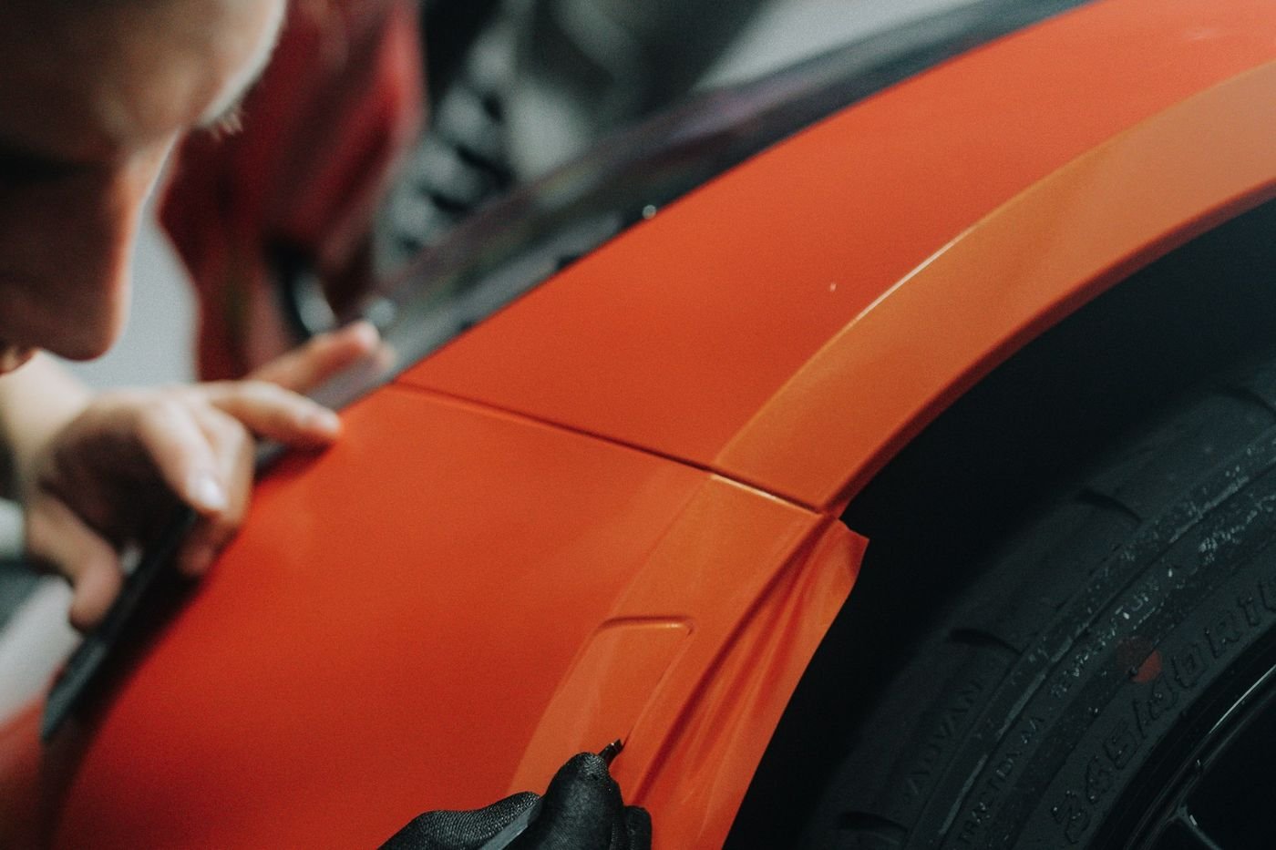 Installer finishing a panel edge by hand