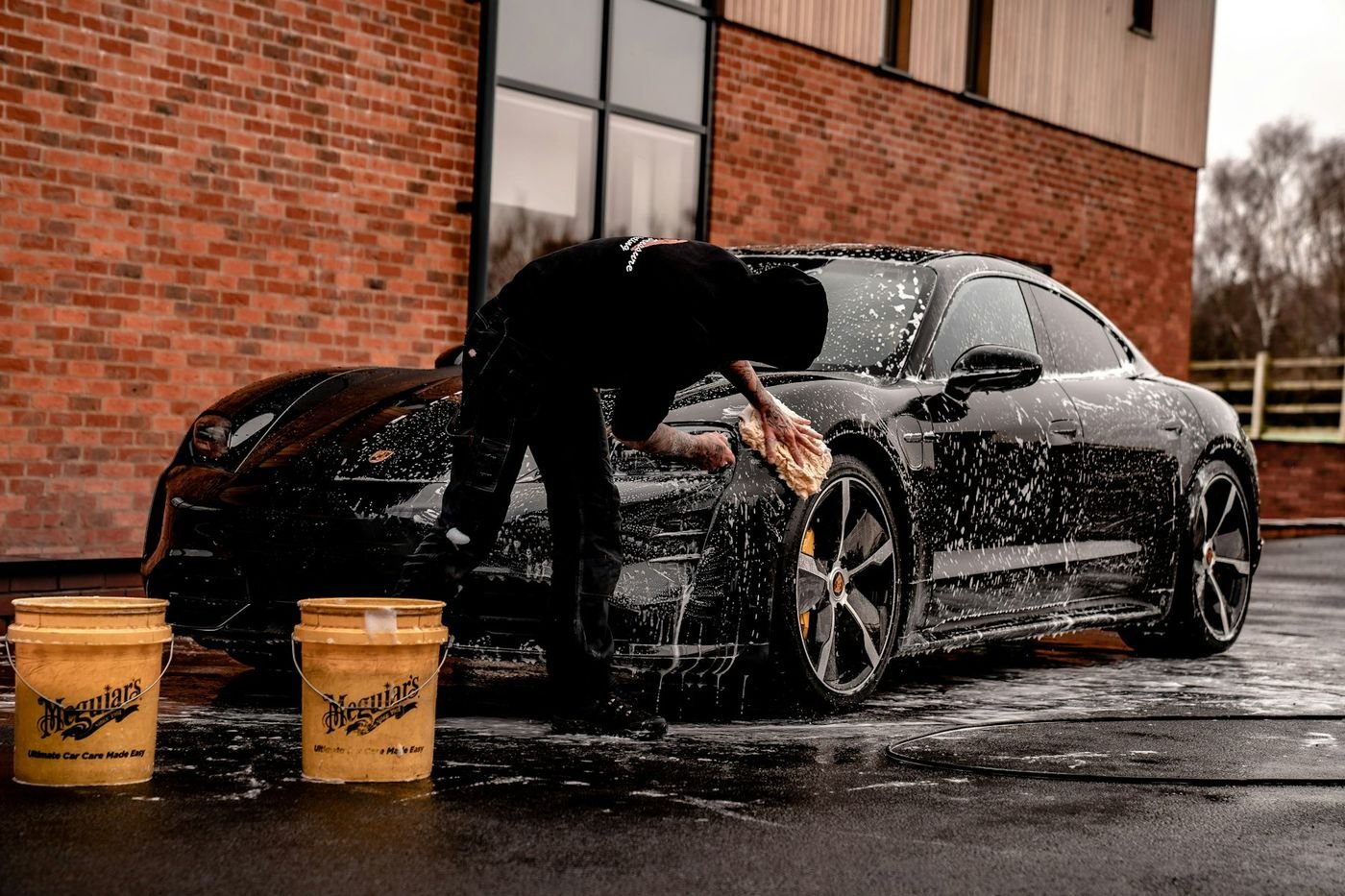 Vehicle covered in pH-neutral foam during a gentle wash